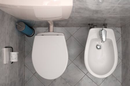 Italian bathroom with a toilet and a bidet, top viewの写真素材