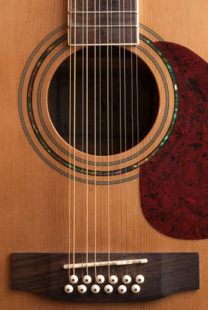 Detail of the body of a 12-string guitar, vertical shotの写真素材
