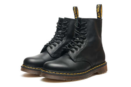 Carrara, Italy - October 07, 2020 - A pair of leather Dr. Martens Air Wair boots on white backgroundのeditorial素材