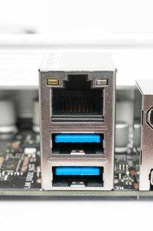 Usb 3.2 type-a and LAN ports on a computer motherboard on white background