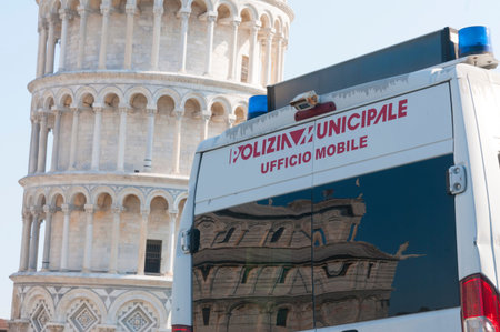 Pisa, Italy - March 10, 2021 - Vehicle of the municipal police of pisa guards the square with the...
