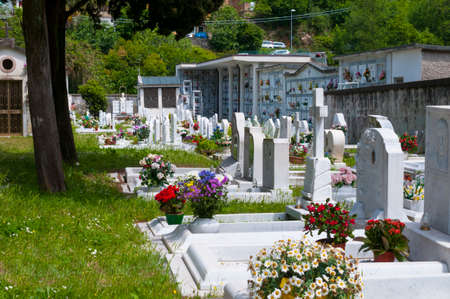 Carrara, Italy - June 01, 2021 - Italian cemetery with white marble tombs and monumentsのeditorial素材