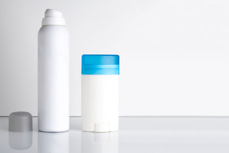 Spray and roll-on deodorant with blank label and reflection with plenty of room for text and graphicsの写真素材