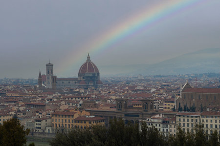 Panorama of the city of Florence with a view of the Duomo topped by a digital rainbowの写真素材