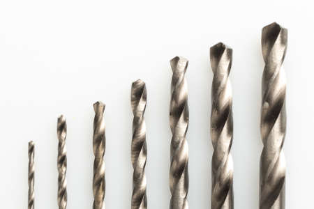 Set of precision drill bits on a white backgroundの写真素材