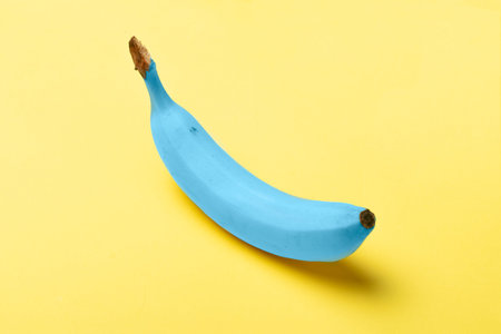 Blue java banana on pastel yellow backgroundの写真素材