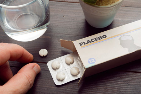 Placebo effect concept: man take a pill from a placebo box of pillsの写真素材