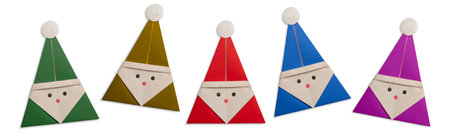 Five origami Santa Claus on white backgroundの写真素材