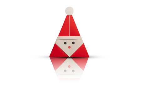 Origami Santa Claus with reflection on white backgroundの写真素材