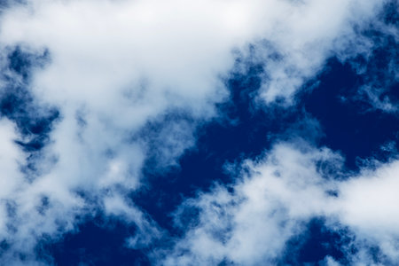 Blue sky background with white clouds. Abstract nature background and texture.の写真素材