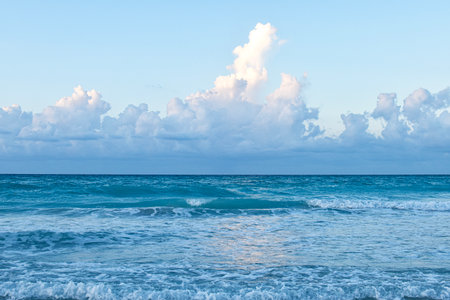 Beautiful view of the ocean and blue sky with white clouds.の写真素材