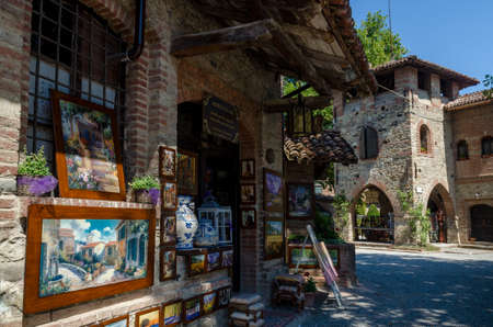 PIACENZA, ITALY - AUGUST 14, 2016 - Historical houses and shops in Grazzano Visconti, neo-gothic village near Piacenza, Italy, on august 14, 2016.のeditorial素材