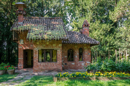 PIACENZA, ITALY - AUGUST 14, 2016 - Little house in the garden of the castle of Grazzano Visconti, Italy, on august 14,2016. The house was made for children to play in.のeditorial素材