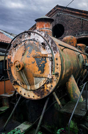 Rusty steam locomotive in the station of Turin Ponte Mosca (Italy), repair workshop for old trainsの写真素材