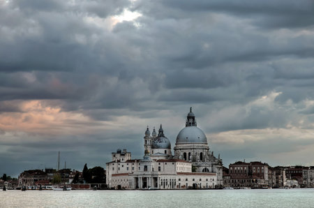 Santa Maria della Salute, church in Venice (Italy) with cloudy skyの写真素材
