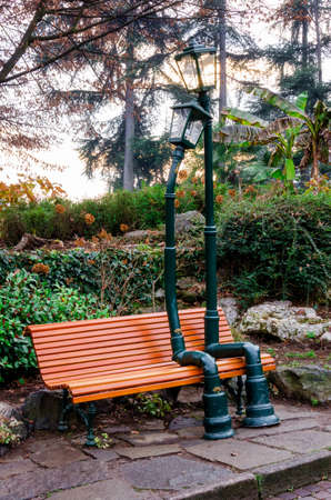 TURIN, ITALY - DECEMBER 11, 2016: Urban sculpture, made by Rodolfo Marasciuolo, of two street lamp in love sitting on a bench of Valentino's Park in Turin (Italy) on december 11, 2016のeditorial素材