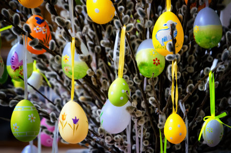 Traditional painted easter eggs hanging from a decorative tree