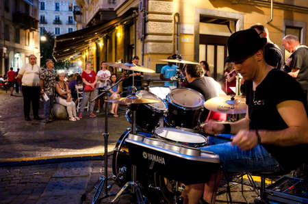 TURIN, ITALY - JUNE 18, 2017: Street band playng music in the center of Turin (Piedmont, Italy) at evening on june 18, 2017, during the Festa della Music (Street Music Festival)のeditorial素材