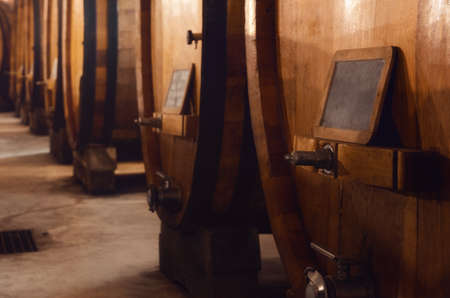 Historic cellar in Piedmont, Italy, with slavonian oak wooden barrels for the the aging of red winesの写真素材