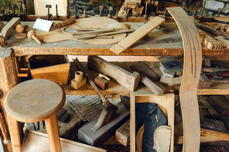 Old luthier's bench in a workshop of a guitar maker craftsman