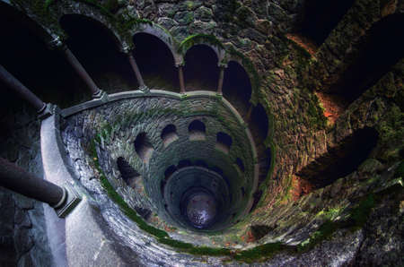 SINTRA, PORTUGAL - FEBRUARY 5 2019: The famous initiation well of the Quinta da Regaleira, masonic spiral staircase of the romantic age in Sintra, Portugal, on february 5, 2019のeditorial素材