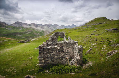 old military barracks ruins from the first wolrd war on the path to Rocca la Meja, one of the most important peaks of the piedmontese Alps, Italyの写真素材