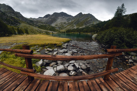 Dramatic sky in dark day over the Lac dâ€™Arpy, beautiful alpine lake near Morgex (Aosta...