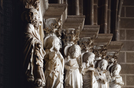 Six of the twelve apostles, with saint Peter in foreground, on the medieval gothic portal outside the cathedral of Evora, ancient manueline church in the alentejo region, portugalのeditorial素材
