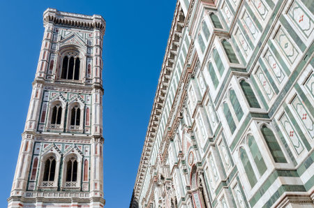 Detail of the famous giotto's campanile, bell tower of the basilica of Santa Maria del Fiore (Saint Mary of the Flower), cathedral of Florence, Italy.の写真素材