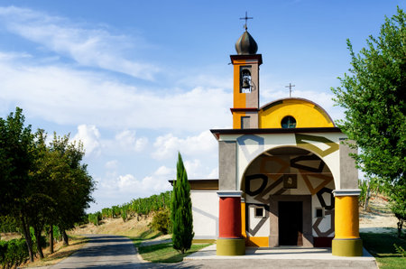 ALBA, ITALY - AUGUST 19, 2017 - The church of Maria del Carmine in Coazzolo, near Alba (Italy) on august 19, 2017. The colorful renovation was made by Sol Lewitt and David Tremlett.のeditorial素材