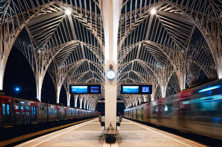 LISBON, PORTUGAL - FEBRUARY 4, 2019: Tre modern train station of gare do oriente in lisbon (portugal) build by santiago calatrava, at night with passengers and trains waiting, on february 4, 2019のeditorial素材