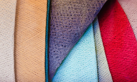 colorful texture detail of many handmade cotton thread fabric weaved lampshades stacked together