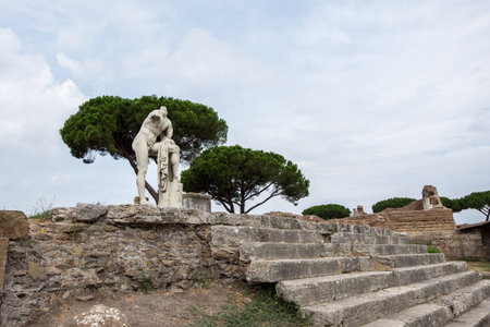 Statue in Ostia among ruinsの写真素材