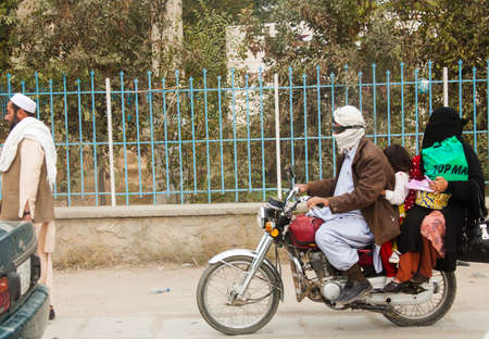 Family riding a bike, in Kabulのeditorial素材
