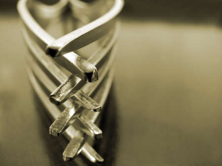 two forks on dark textured background, black and whiteの写真素材