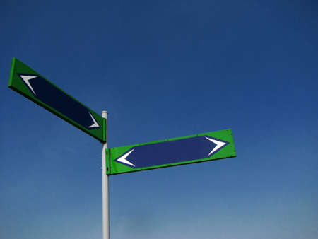 Two blank direction signs on blue sky backgroundの写真素材