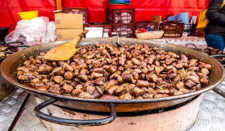 Huge tray with fried pieces of sausage at a food fair in Romania. Traditional romanian pork sausages.の写真素材
