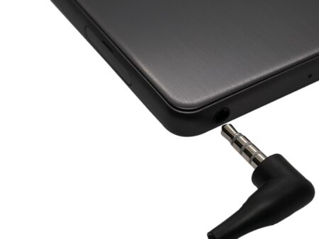 Audio headphone jack and a phone with a jack for headphones.の写真素材