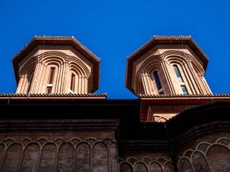 Two towers of a historic church in Bucharest. Architectural detail of a church.の写真素材