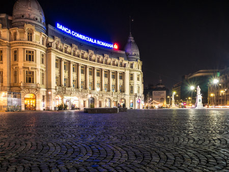 Bucharest/Romania â 02.29.202:Oscar Maugsch Palace in the center of Bucharest. Night photo with the Headquarters of the Romanian Commercial Bank ( BCR).のeditorial素材
