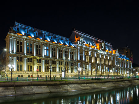 Bucharest/Romania â 02.29.2020: Night photo of Palace of Justice in Bucharest, alongside Dambovita river. Beautiful architecture in the center of Bucharest.のeditorial素材
