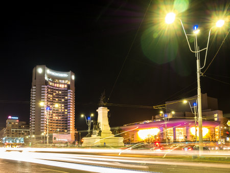 Bucharest/Romania â 02.29.202: Intercontinental Hotel situated right in the center of Bucharest. Night photo of National Theatre Bucharest and Intercontinental Hotel situated in University Square.のeditorial素材