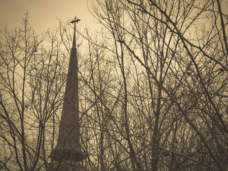 Old christian church in Romania. Vintage looking church between treesの写真素材