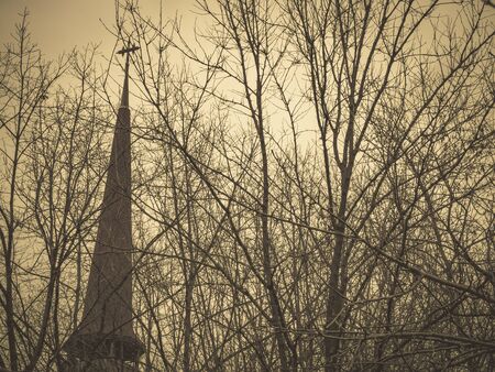 Old christian church in Romania. Vintage looking church between treesの写真素材