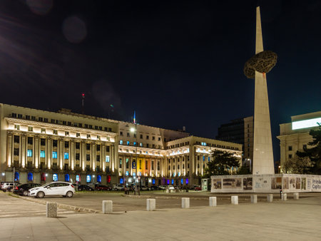 Bucharest/Romania â 03.21.2020: Night photo of the Memorial of Rebirth and Ministry of Internal Affairs situated on Victory avenue (calea Victoriei) in the center of Bucharest.のeditorial素材