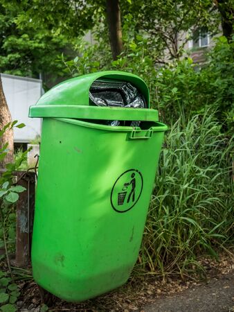 Green garbage bin in Bucharest, Romania.の写真素材