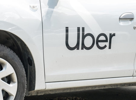 Bucharest/Romania - 05.05.2020: Uber logo inscriptioned on a white painted car.