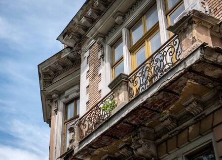 Architecture detail of a balcony. Worn out balcony in the old town of Bucharest.の写真素材