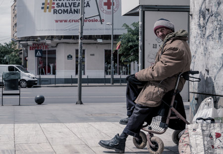Bucharest/Romania - 05.07.2020: Homeless man looking at the camera. Beggar in the center of Bucharest.のeditorial素材