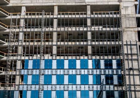 Modern office building under construction in Bucharest. detail with a unfinished office building.の写真素材